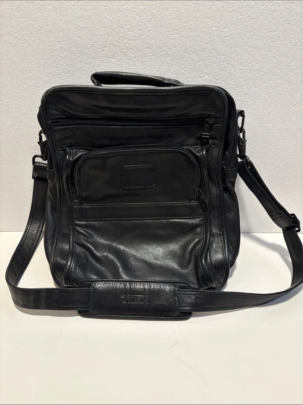 Tumi Black Laptop Backpack with Red Logo Accent